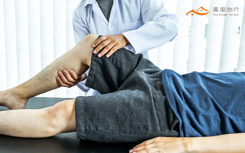 patient doing physical exercises with physiotherapist