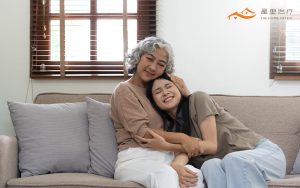woman hugging her elderly loved ones