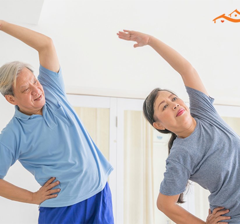 Elderly couple doing stretching exercises